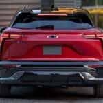 A red 2024 Chevy Blazer EV SS is shown from the rear parked at a Blazer EV dealer.