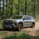 Silver 2026 Chevy Traverse Z71 driving on a dirt trail