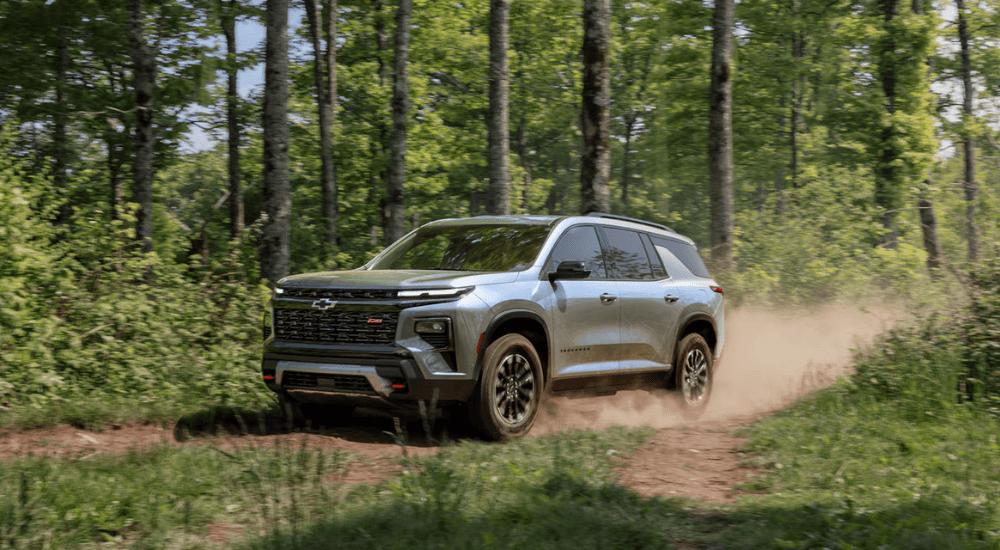 Silver 2026 Chevy Traverse Z71 driving on a dirt trail