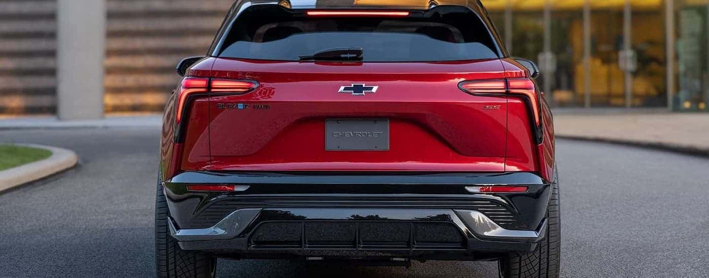 A red 2024 Chevy Blazer EV SS is shown from the rear parked in a driveway