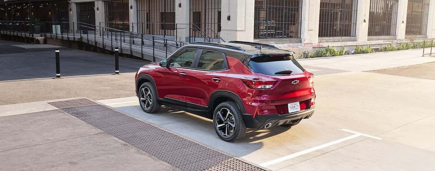 Red 2022 Chevy Trailblazer RS parked in front of a concrete building