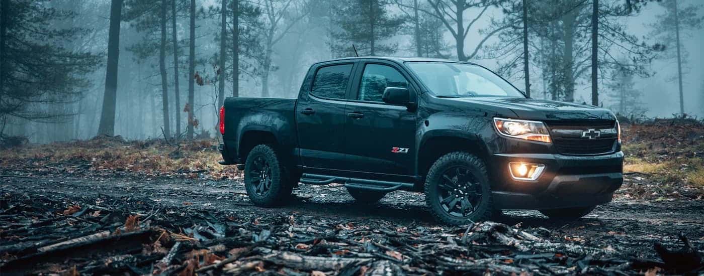 A black 2021 Chevy Colorado Z71 is shown in the woods after leaving a Spring Texas Chevy dealer