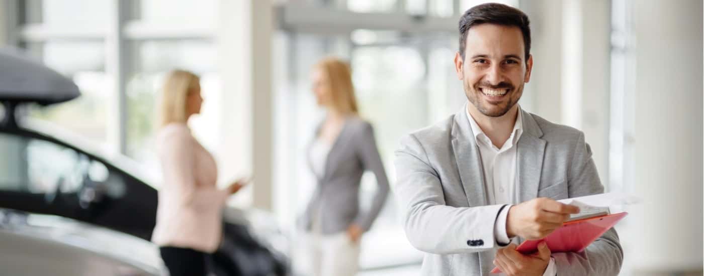 A car salesman is shown at The Woodlands Chevrolet dealership
