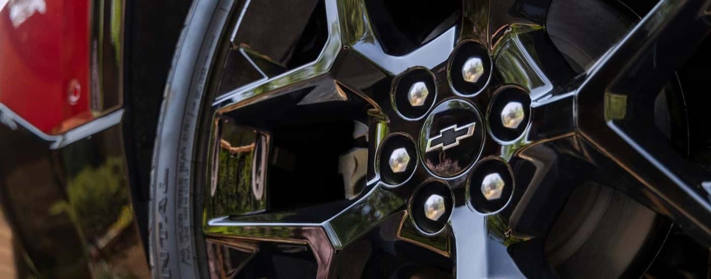Wheel of a red 2024 Chevy Traverse RS