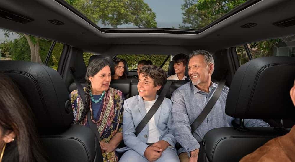 Several passengers in a 2026 Chevy Traverse.