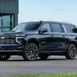 A blue 2026 Chevy Suburban High Country for sale parked outdoors.