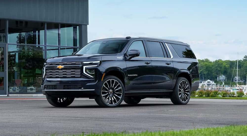 A blue 2026 Chevy Suburban High Country for sale parked outdoors.