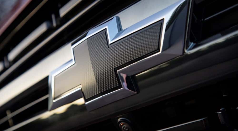 Close-up of the Chevy badge on a 2021 Chevy Tahoe for sale near Houston.