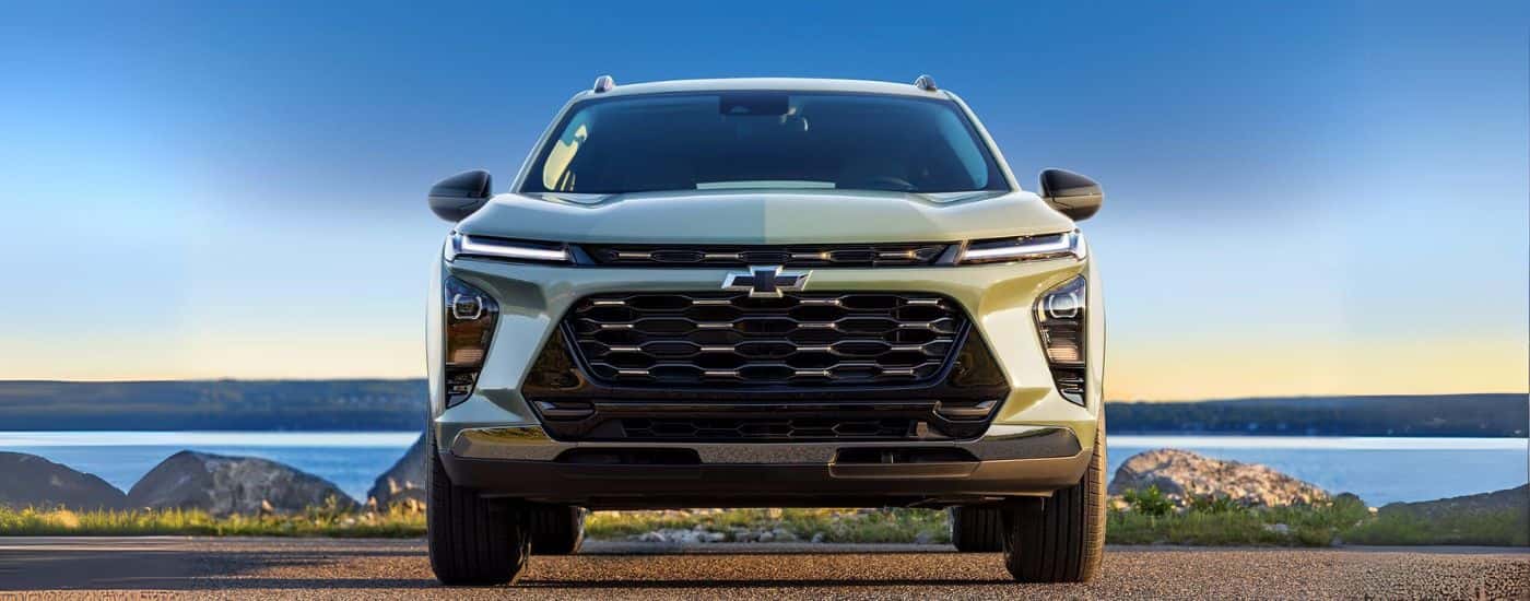 Green 2024 Chevy Trax parked near a lake