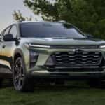 A green 2025 Chevy Trax parked on grass