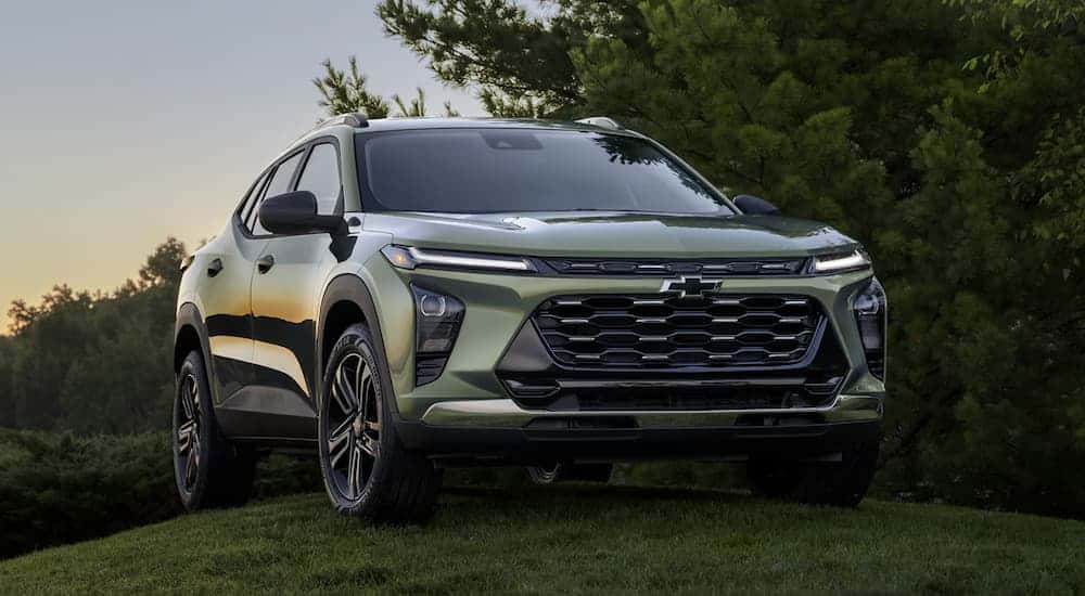 A green 2025 Chevy Trax parked on grass