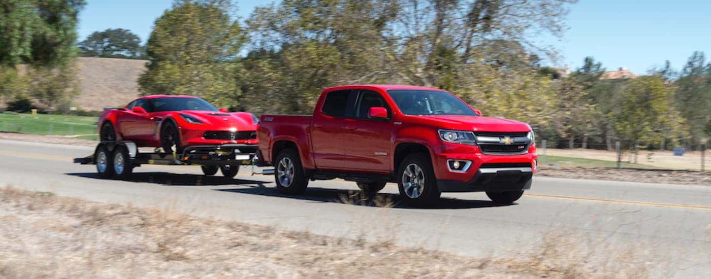 Red 2018 Chevy Colorado Z71 towing a Corvette