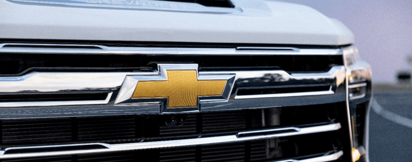 Chrome Grille and Chevrolet Logo on a White 2026 Chevy Silverado 1500