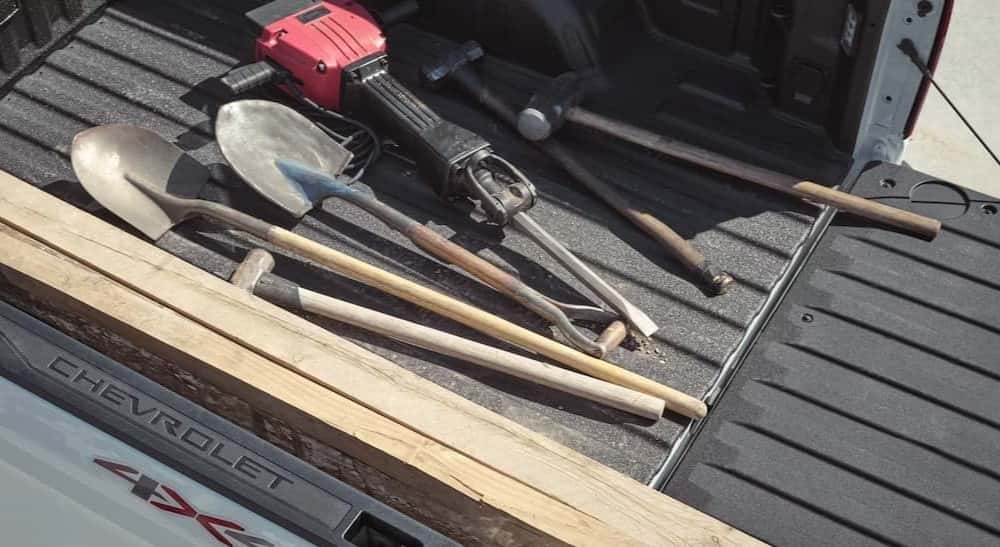 Tools in the bed of a 2026 Chevy Silverado 1500.