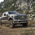 A gray 2023 Ford F-250 Tremor off-roading.