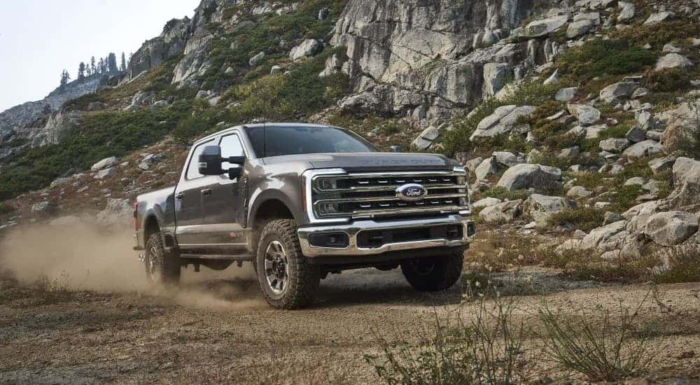 A gray 2023 Ford F-250 Tremor off-roading.
