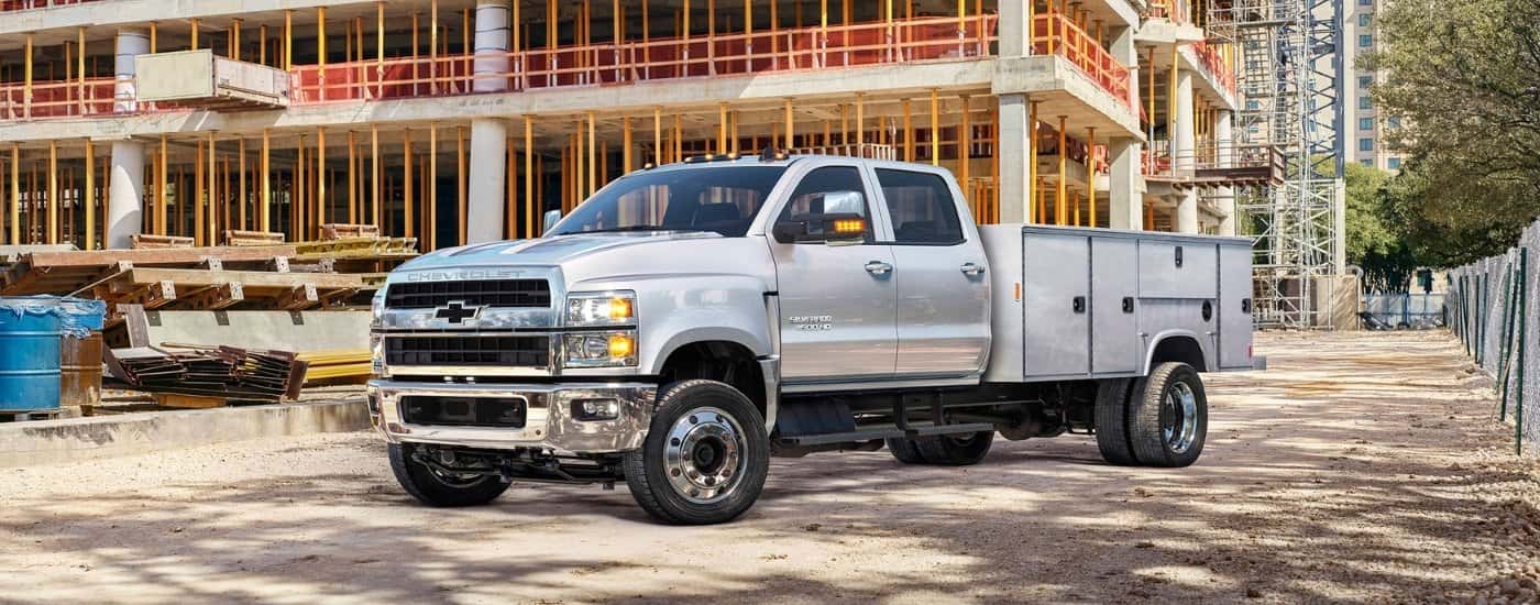 Silver 2020 Chevy Silverado 4500 HD parked on a construction site