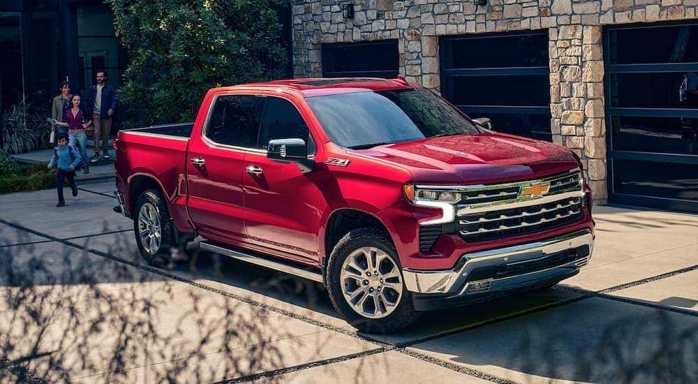 Red 2025 Chevy Silverado 1500 parked in a driveway