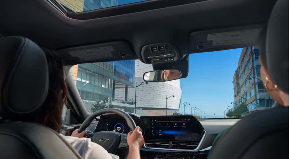 Interior view of a driver and passenger in a 2026 Chevy Trax.