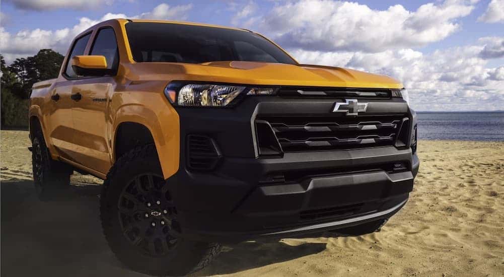A yellow 2026 Chevy Colorado parked near water.