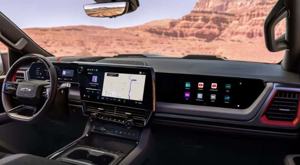 The front interior showing the passenger screen on a 2027 Chevy Silverado 1500.
