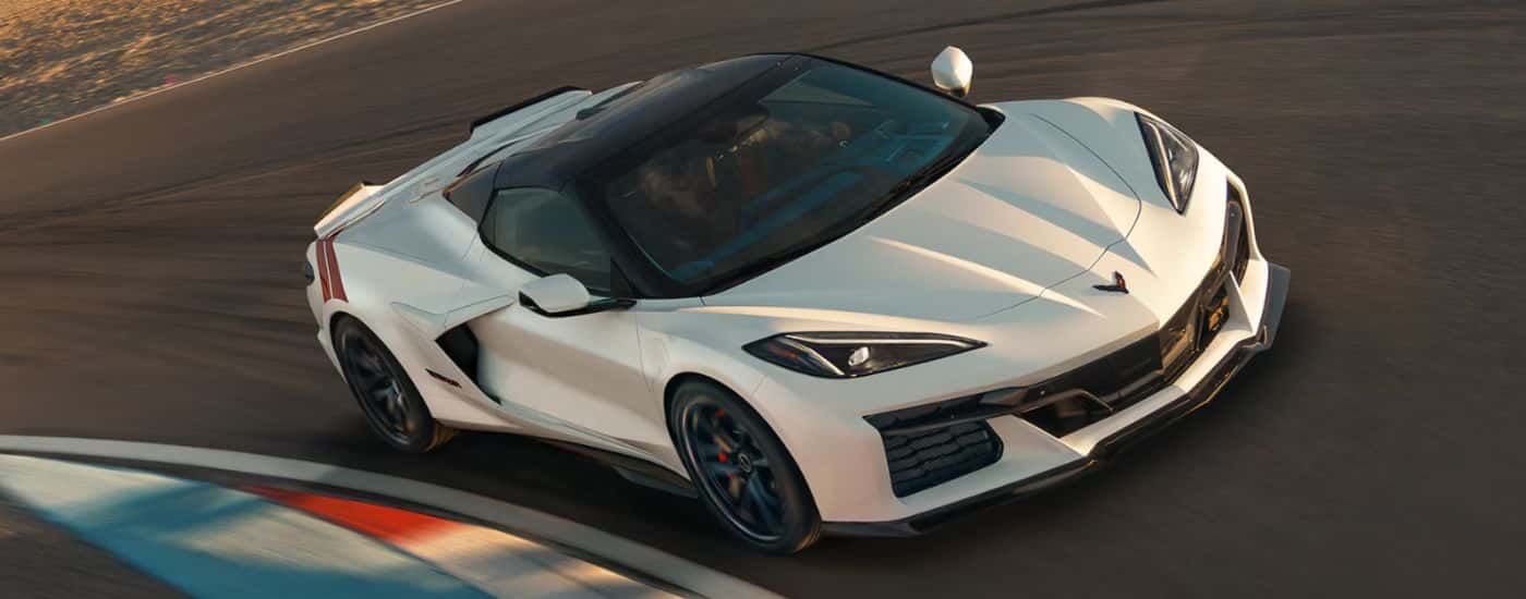 A white 2027 Chevy Corvette Grand Sport on a race track.