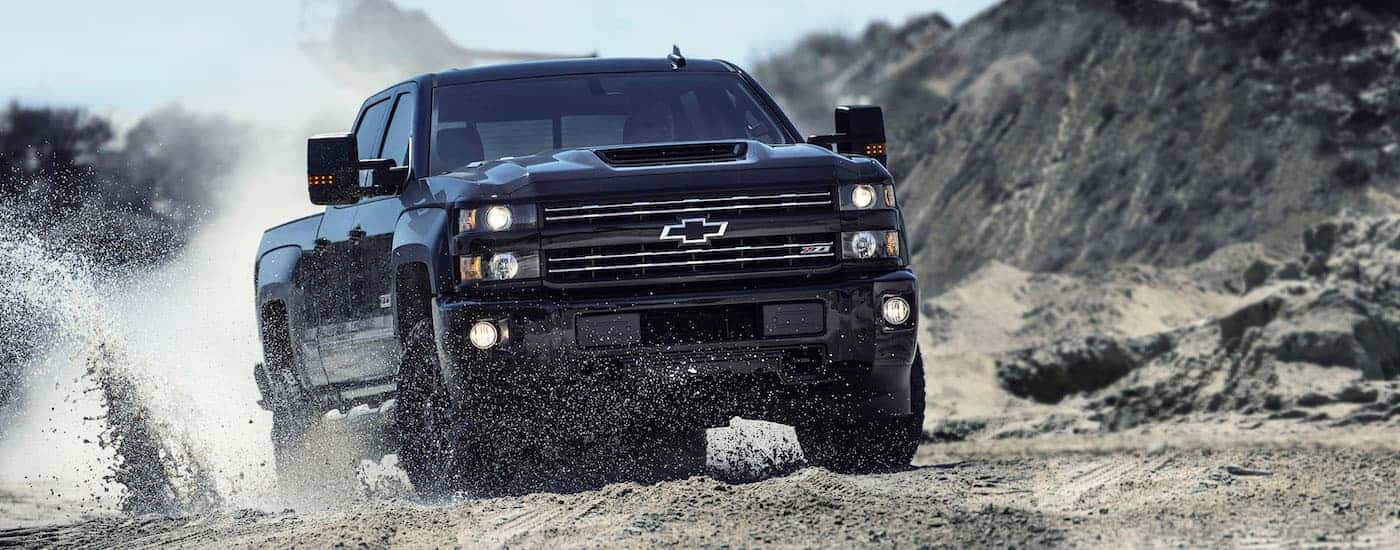 Black 2017 Chevy Silverado 2500 HD Z71 driving off-road.