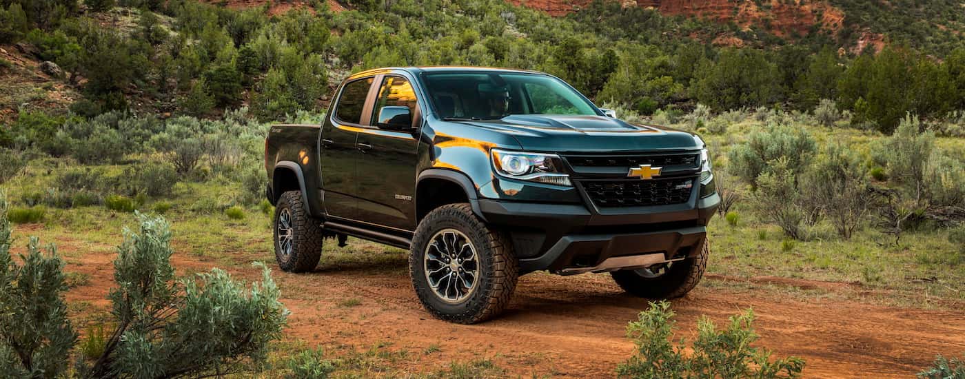 Black 2020 Chevy Colorado ZR2 parked in the woods.