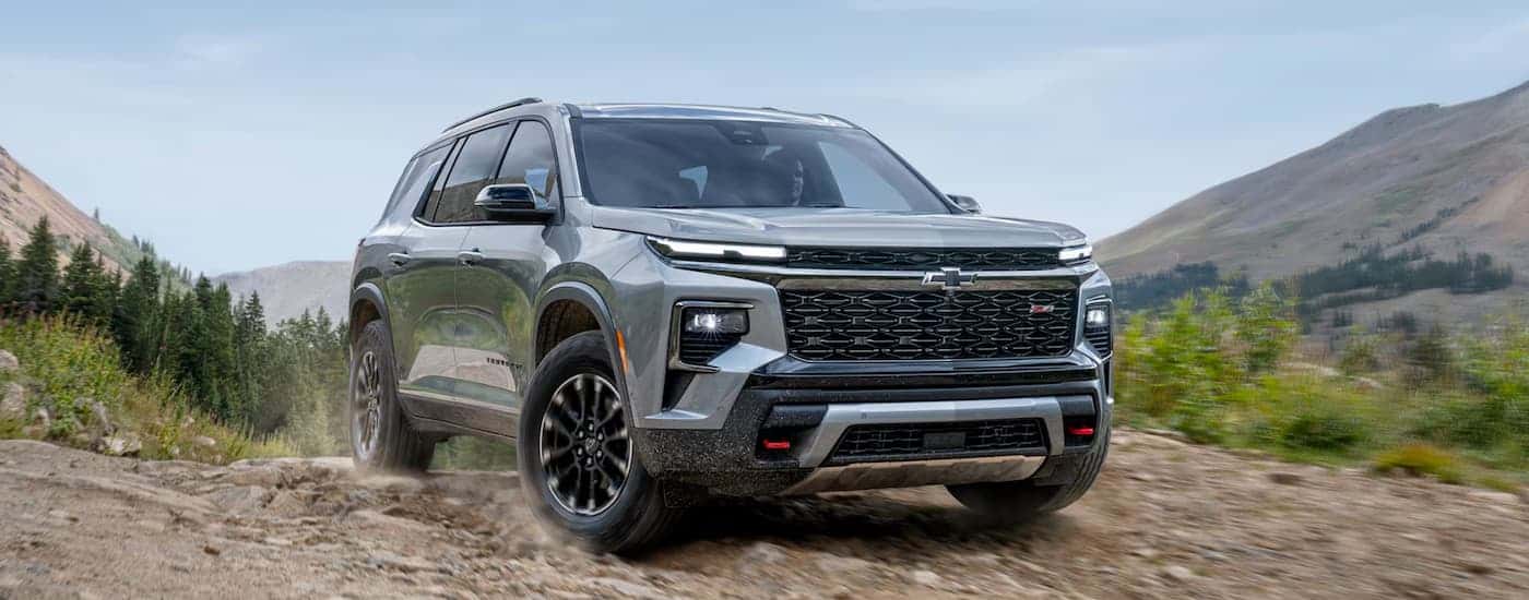 A silver 2025 Chevy Traverse Z71 parked off-road