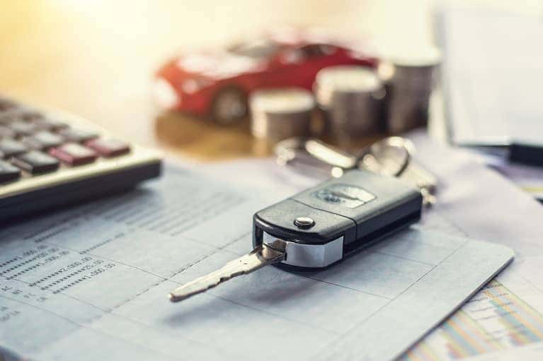 car keys laying on finance paper