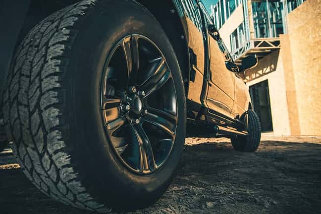 close up of rear wheel on parked car