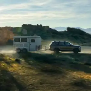 2025 Kia Telluride Side View Towing in Motion