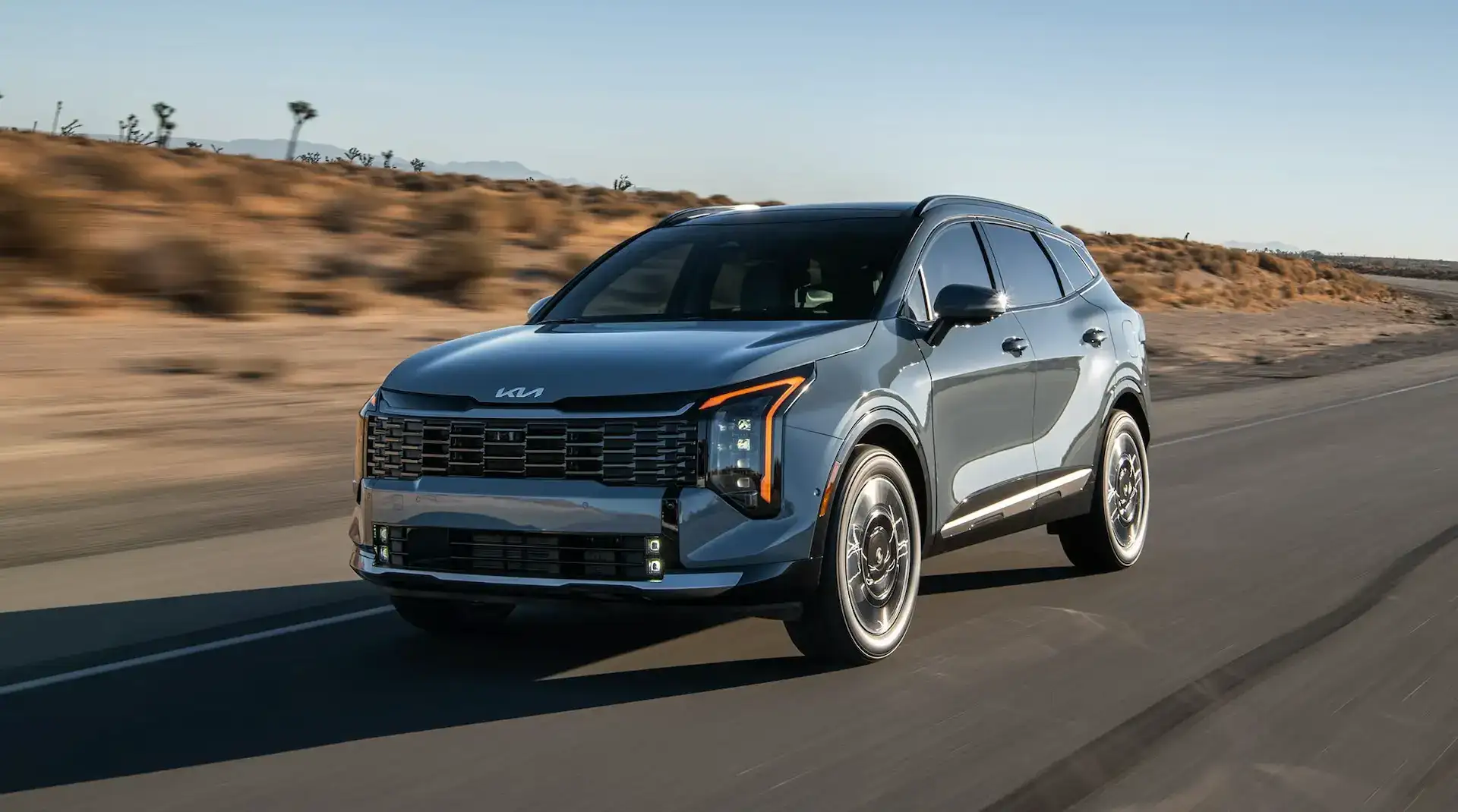 2026 Kia Sportage Hybrid Plug-in Hybrid Front Side View on the Road