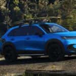 Blue 2026 Honda HR-V Sport parked near a lake