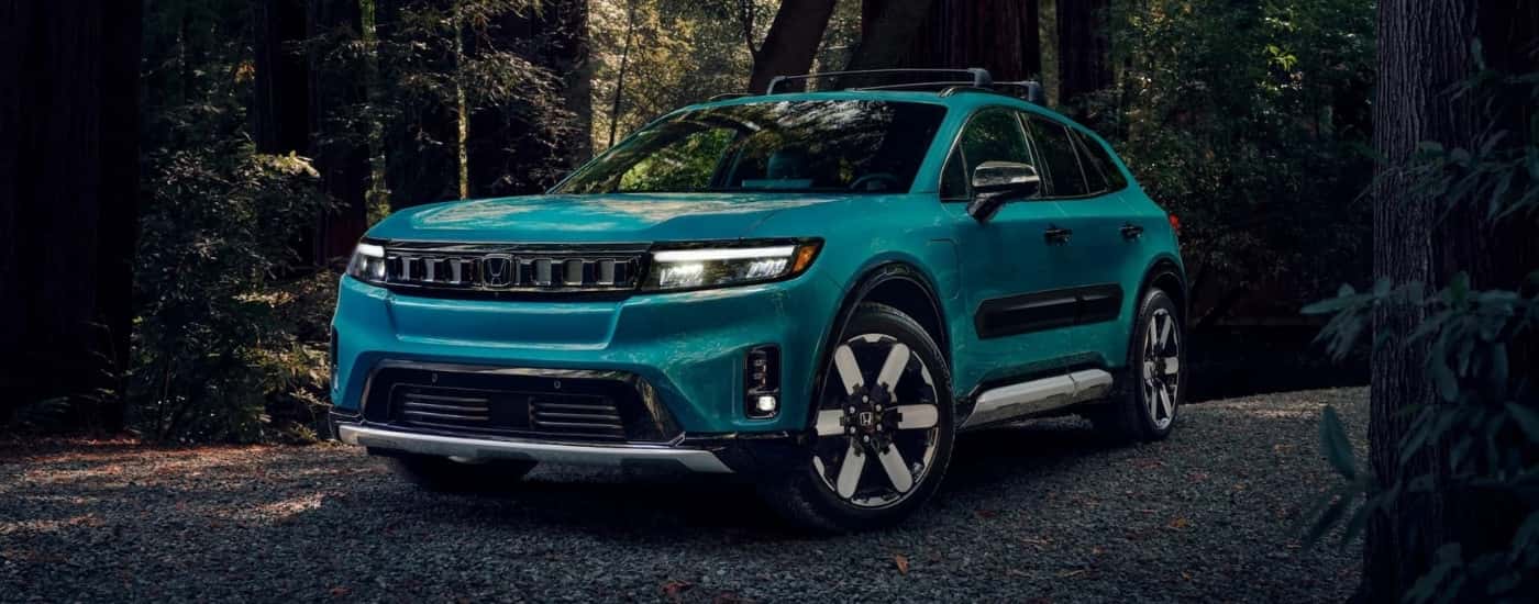 Teal 2024 Honda Prologue Elite parked in a clearing