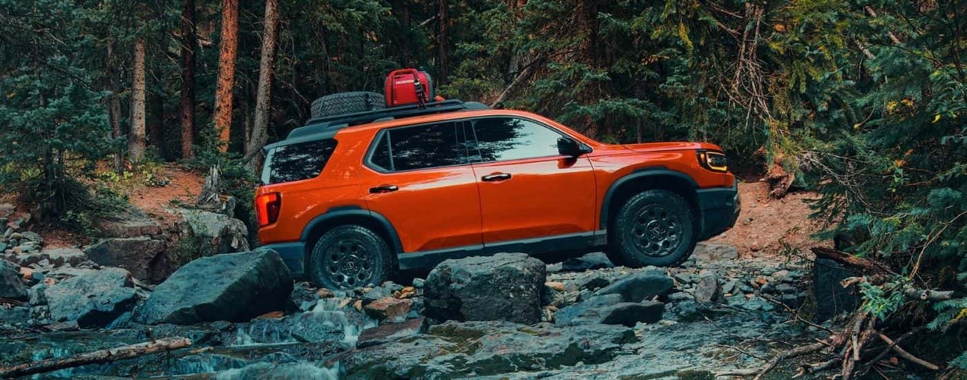 Orange 2026 Honda Passport TrailSport Elite off-roading