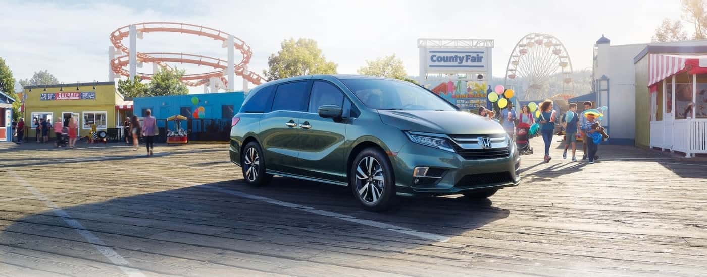 Green 2020 Honda Odyssey at a county fair