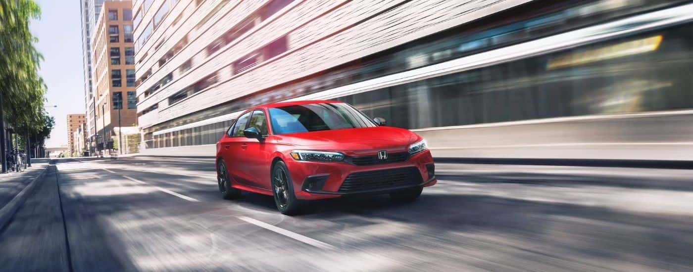 Red 2023 Honda Civic for sale on a test drive