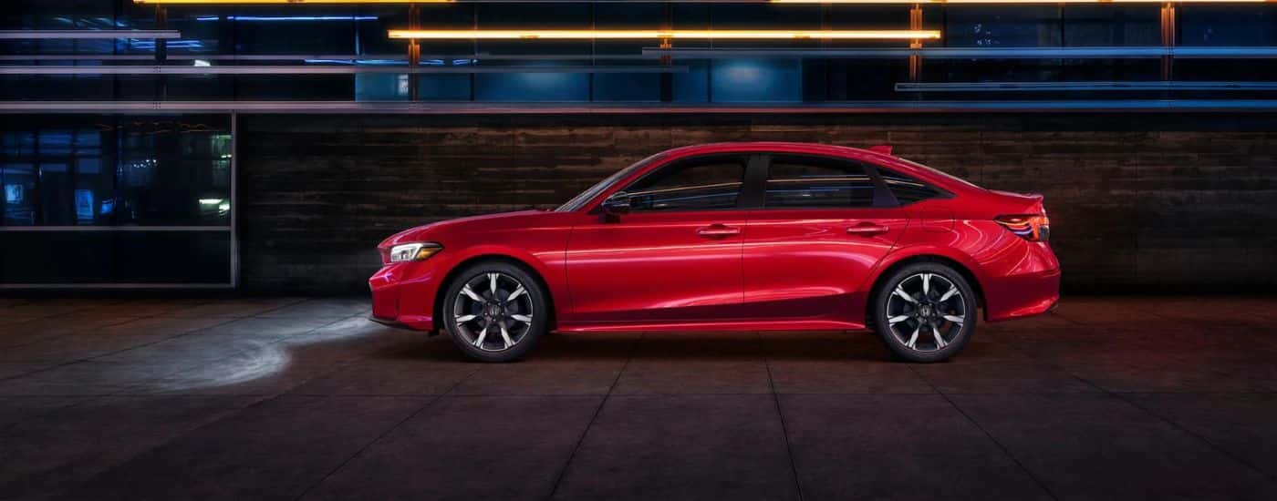 Red 2026 Honda Civic Sport from the side
