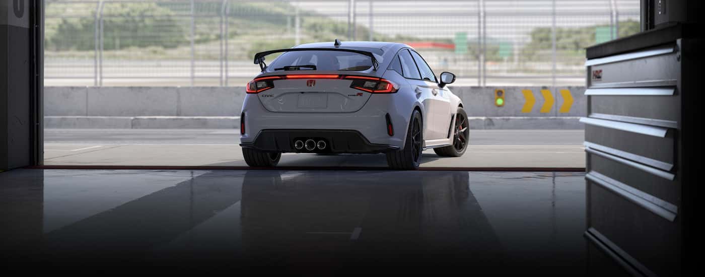 A white 2024 Honda Civic Type R from the rear.