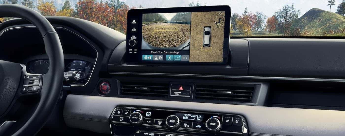 The black and gray dash in a 2026 Honda Pilot for sale.