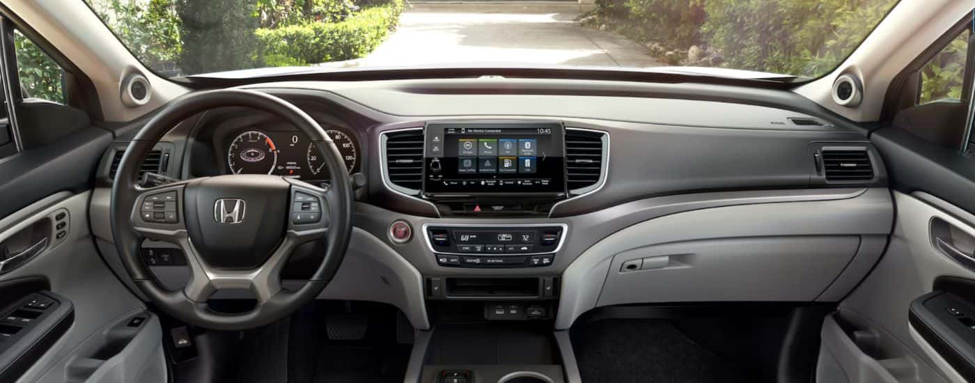 Interior view of a 2026 Honda Ridgeline infotainment system and gauge cluster.