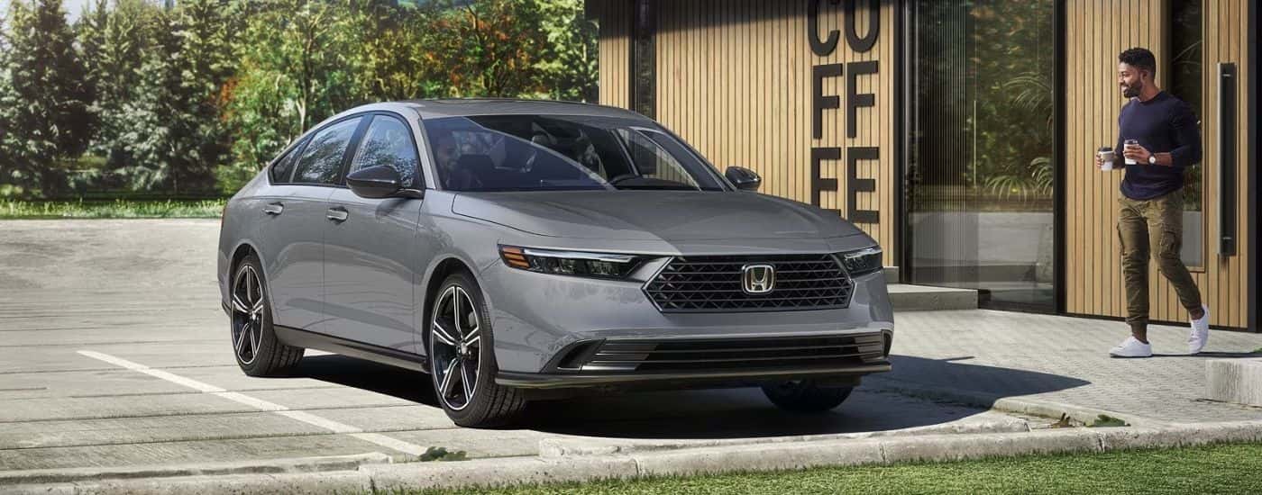 2026 Honda Accord Hybrid parked outside a coffee shop.