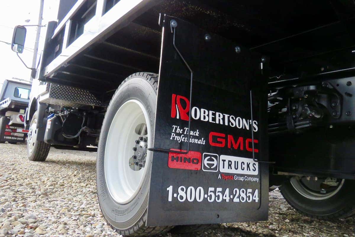 Commercial truck with service center mudflaps