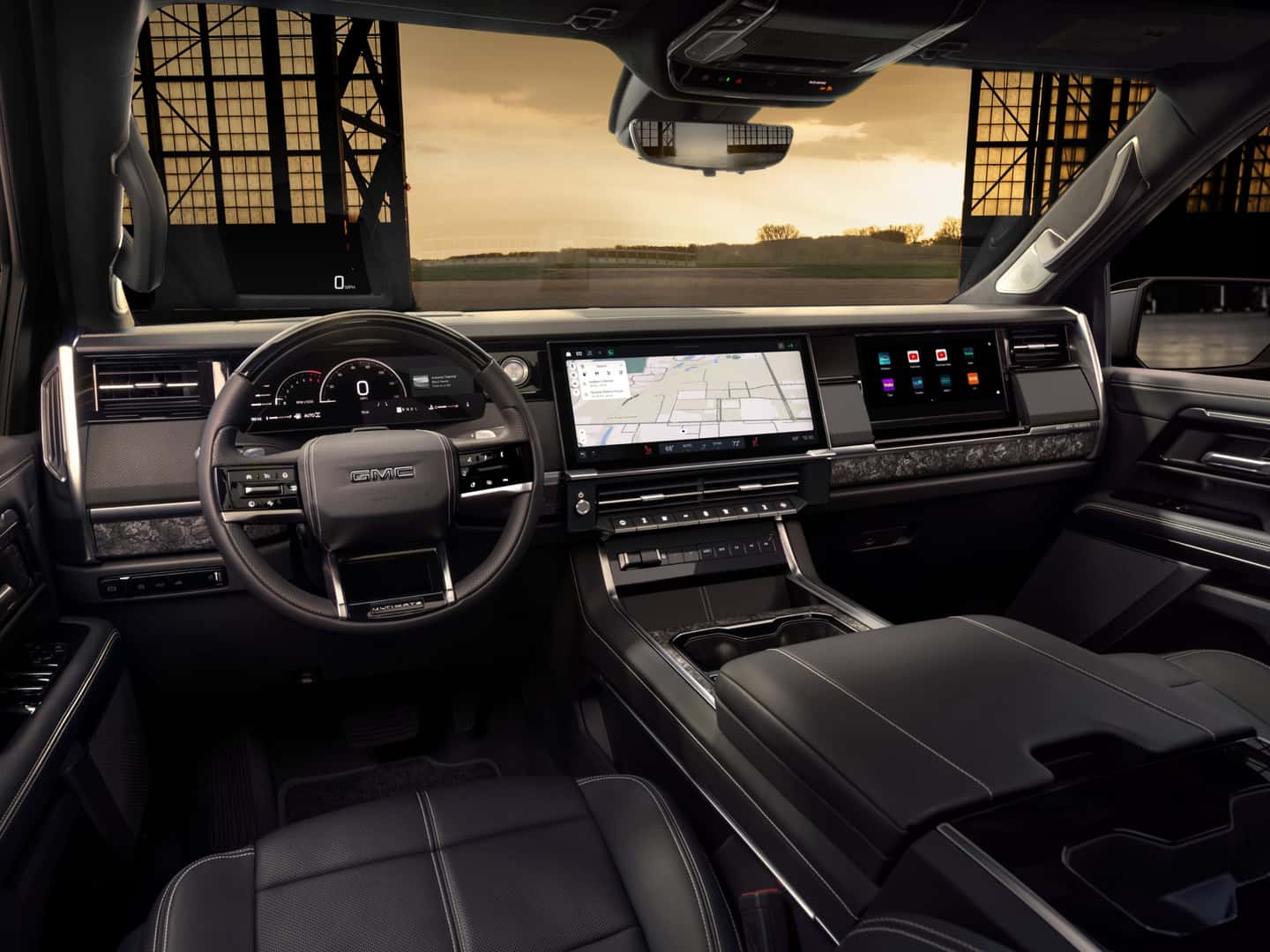 2027 GMC Sierra 1500 Denali Ultimate interior with 16.3-inch infotainment screen, driver display and passenger screen