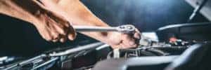 Mechanic working on a vehicle engine