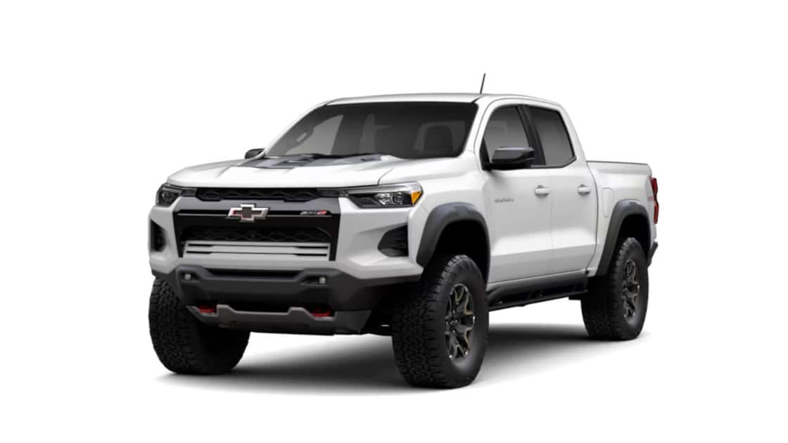 White Chevrolet Colorado ZR2 pickup shown in front three-quarter view with off-road tires and rugged exterior styling.