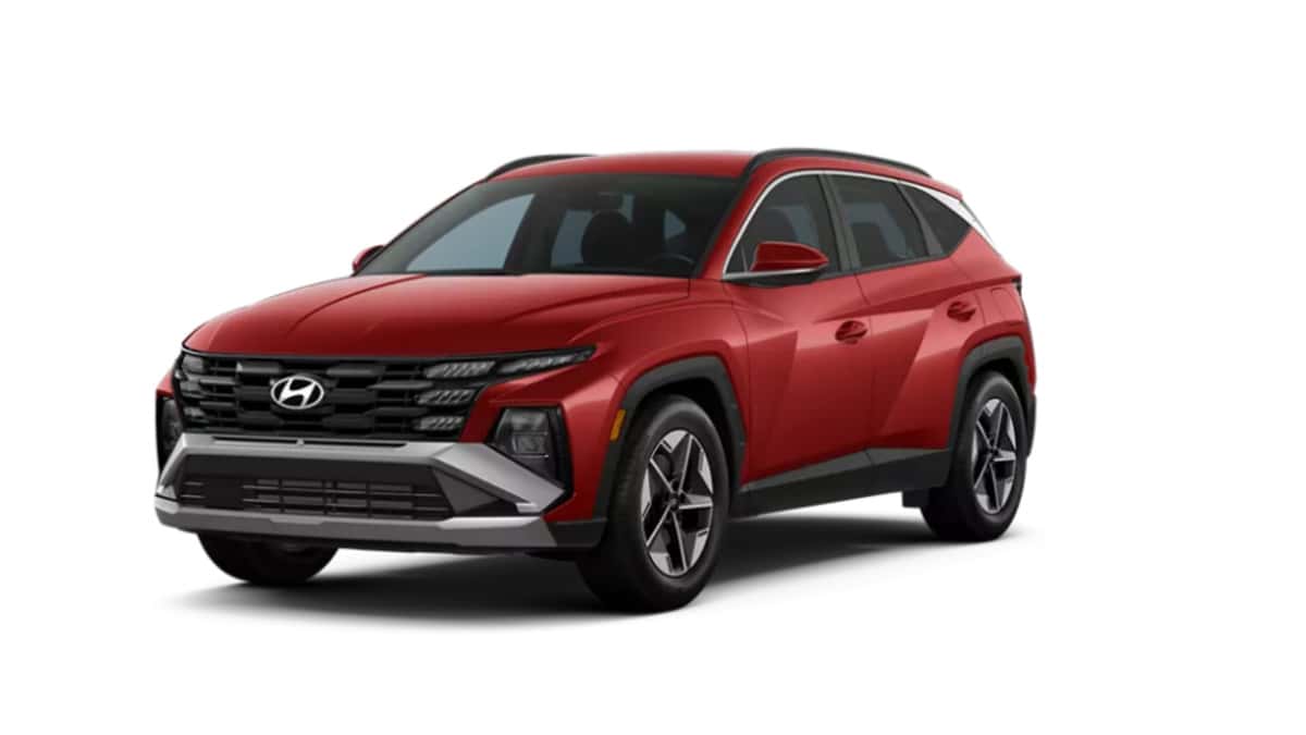 2026 Hyundai Tucson in red shown in a front three-quarter studio view with sharp body lines and modern SUV design.