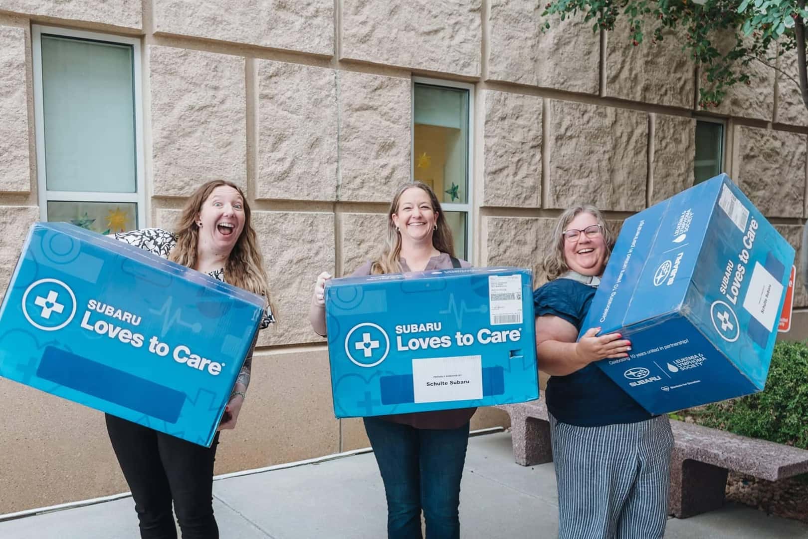 carrying subaru loves to care boxes