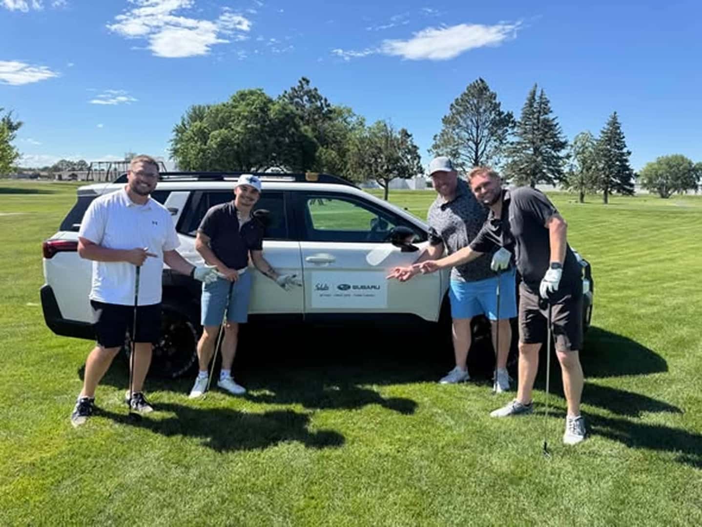 posing next to van